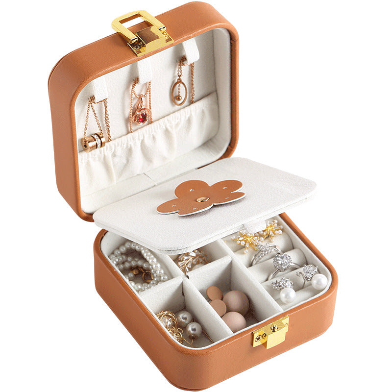 Mini travel jewelry case in brown, open with mirror
