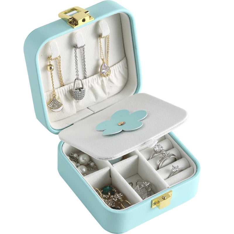 Mini travel jewelry case in sky blue, open with mirror